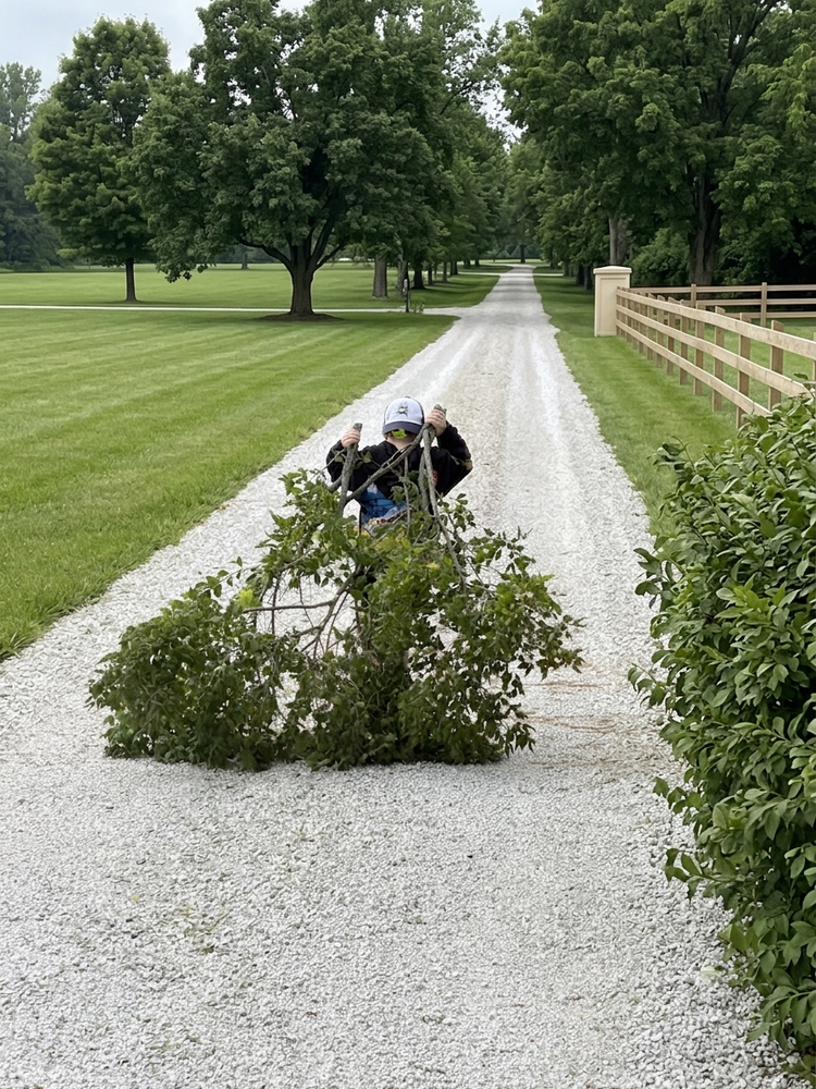 Nichols Land and Home Services working on a property driveway